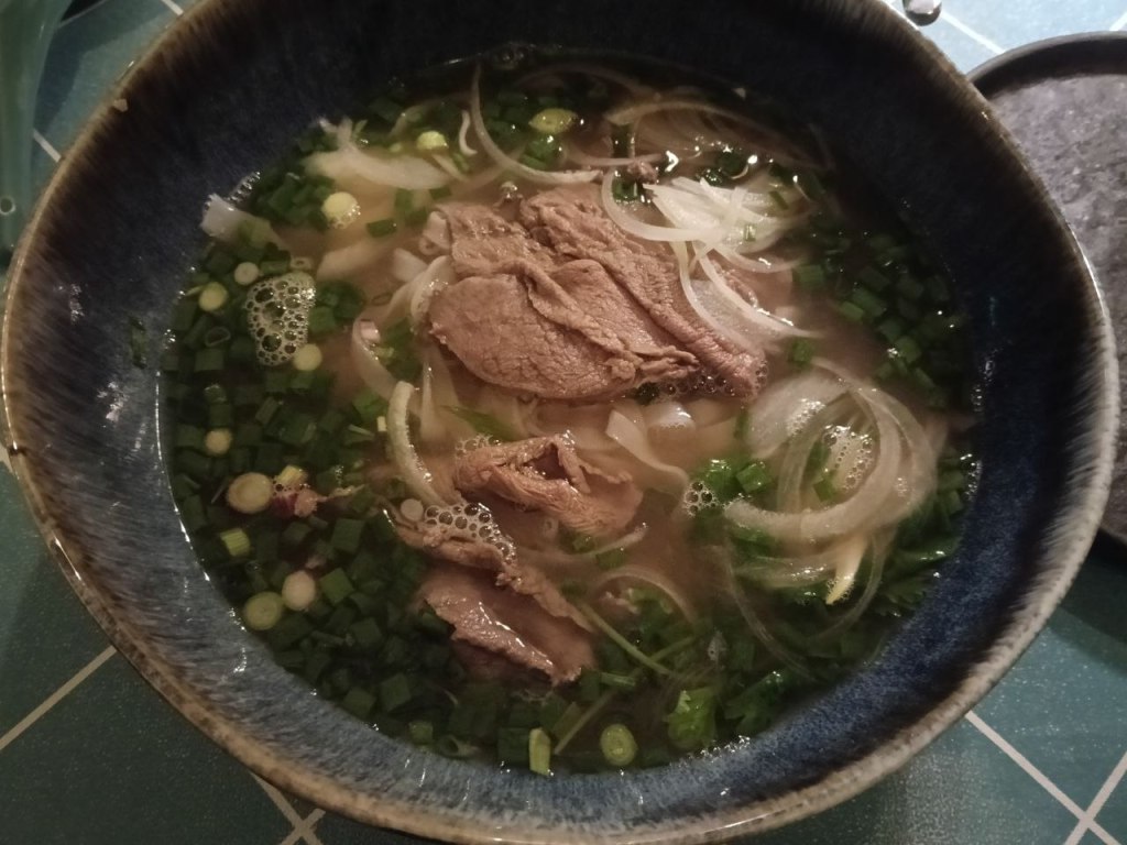 Blue ceramic bowl of beef pho at Sao Nam