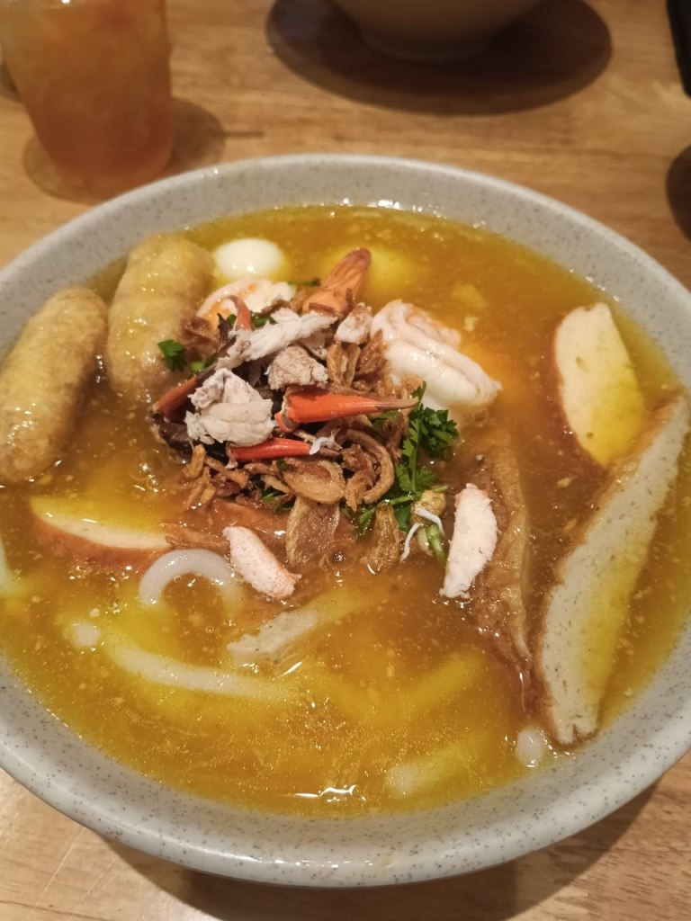 Special crab shooting dish with crab meat, squid, fried fish balls and noodles in Phnom Penh
